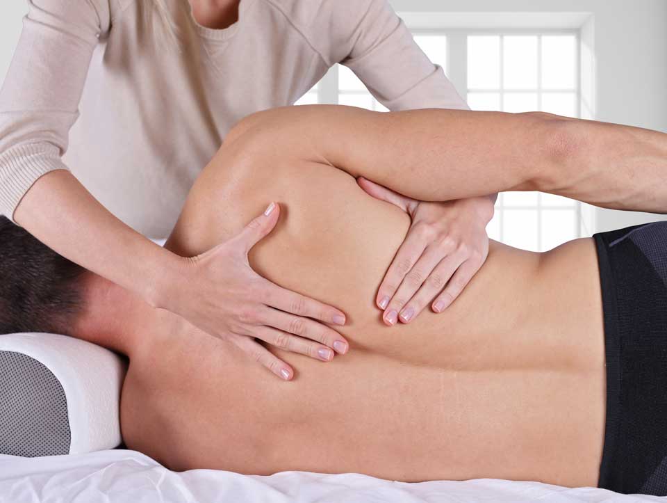 a chiropractic back pain relief is being performed on a patient